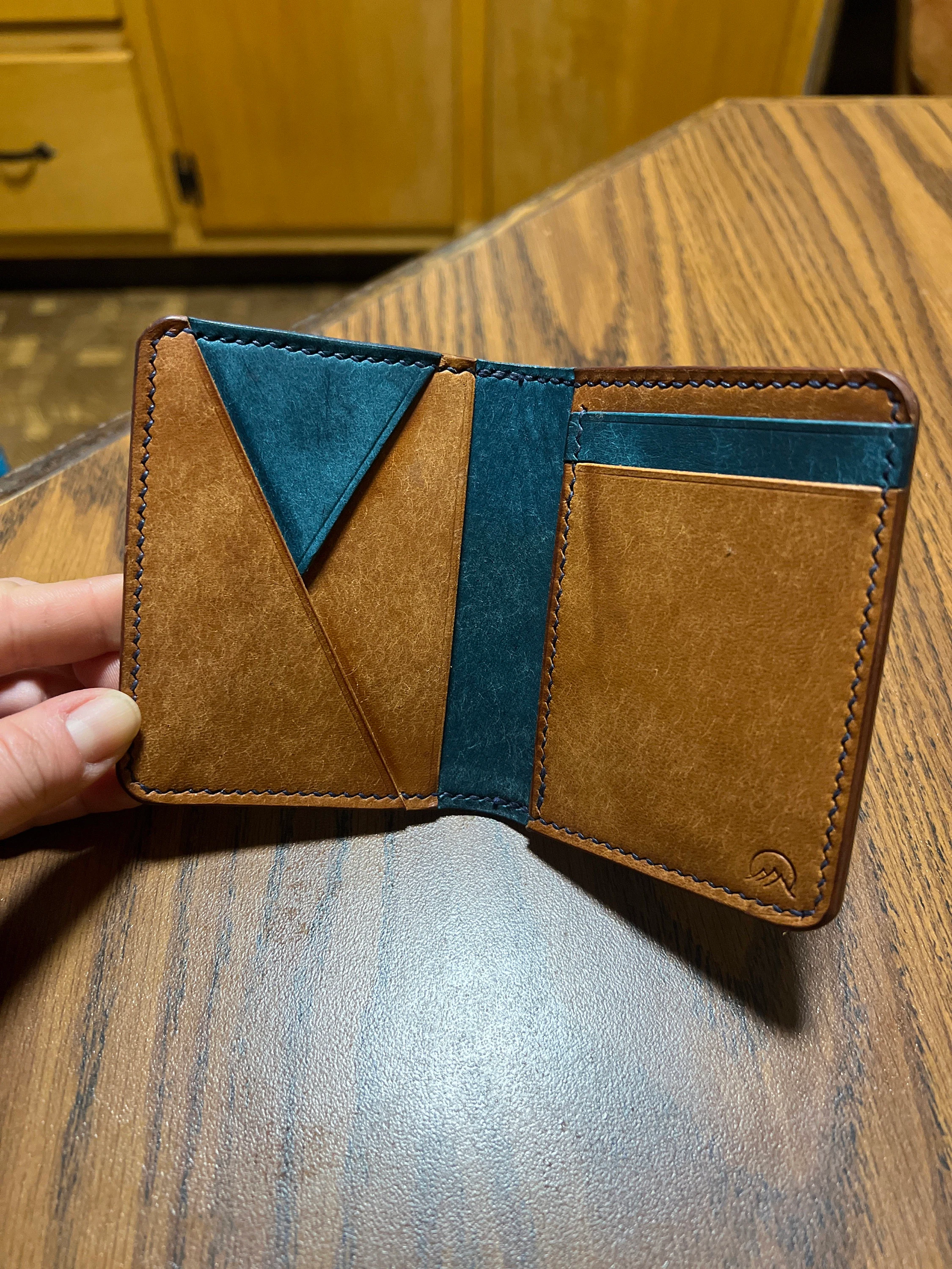 Customer photo submitted with rox11492's December 2021 Etsy review showing an open brown and blue Signature Wallet.